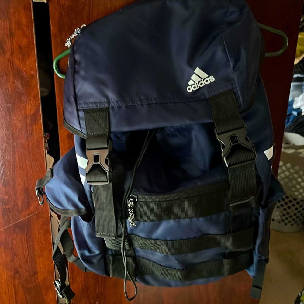Navy blue Adidas backpack. Perfect for work or school.
